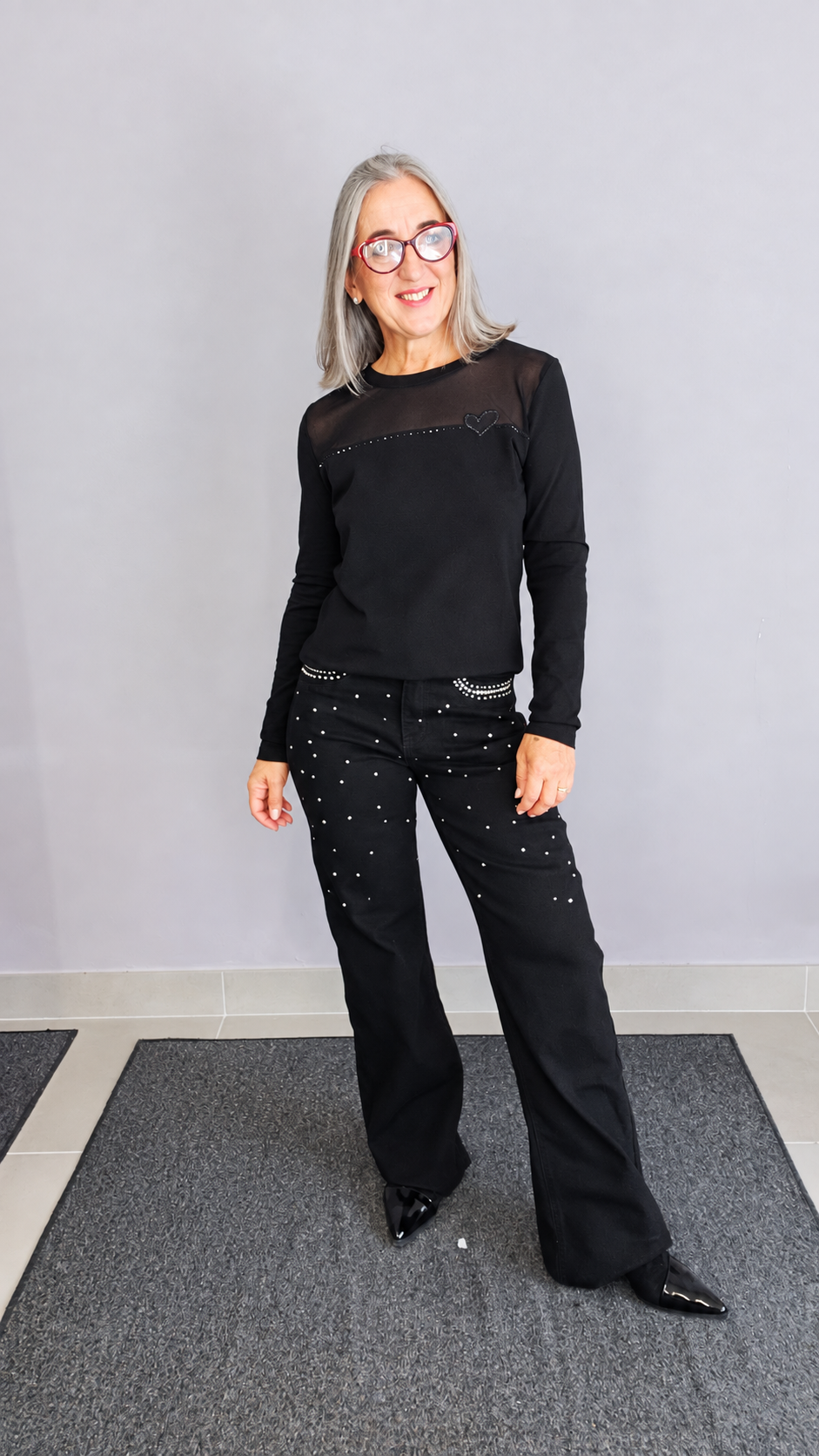JEANS WIDE LEG CON BORCHIE E STRASS