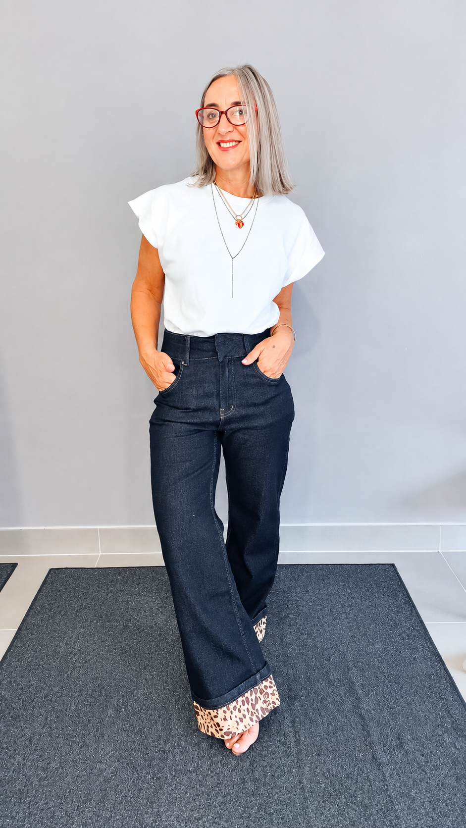 JEANS CON RISVOLTO ANIMALIER