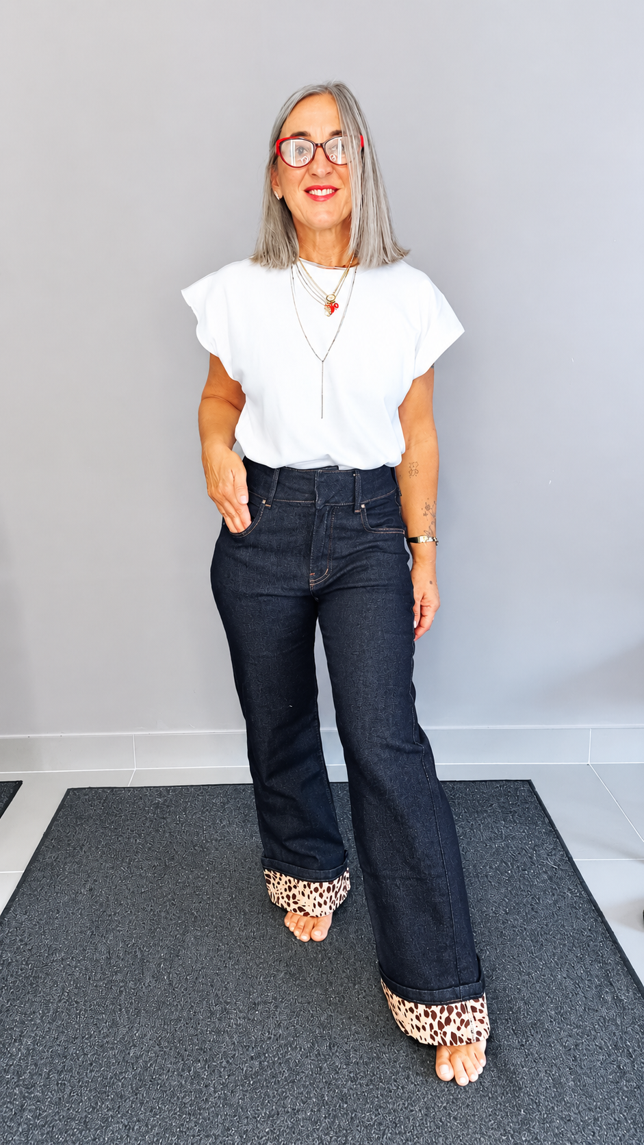 JEANS CON RISVOLTO ANIMALIER