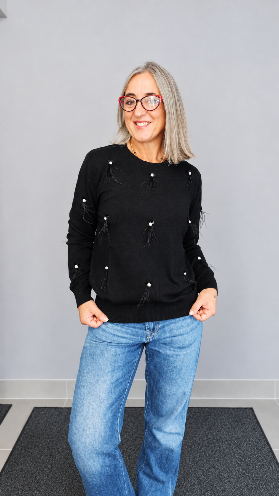 MAGLIA CON PIUME